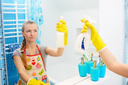 Professional oven cleaner in Knightsbridge deep cleaning a luxury kitchen appliance