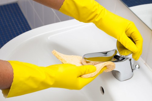 Experienced office cleaners in Knightsbridge vacuuming and polishing a sleek office floor